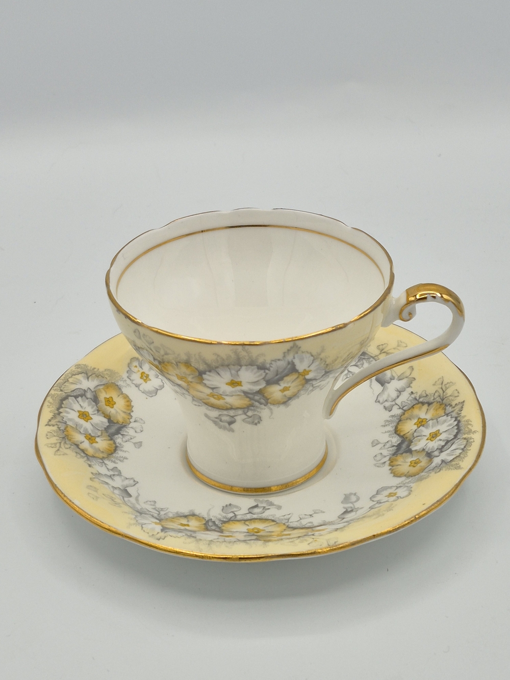 Vintage Cream Floral Aynsley Bone China Teacup and Saucer in Yellow and Gold